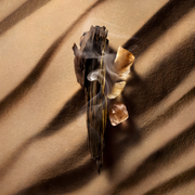 Louis Vuitton Ombre Nomade perfume bottle with luxurious oud fragrance, premium branding and elegant design showcased.